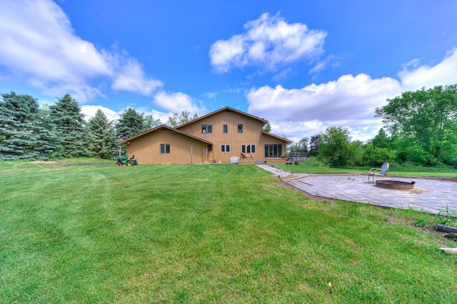 4470 Peach Ridge Ave NW, Grand Rapids, MI 49544 - back of property with a patio area and a lawn