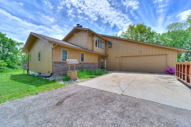 4470 Peach Ridge Ave NW, Grand Rapids, MI 49544 - view of front of house featuring driveway, an attached garage, brick siding, a front yard, and a chimney