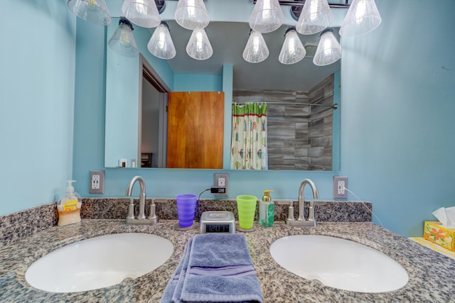4470 Peach Ridge Ave NW, Grand Rapids, MI 49544 - bathroom with double vanity and a shower with curtain