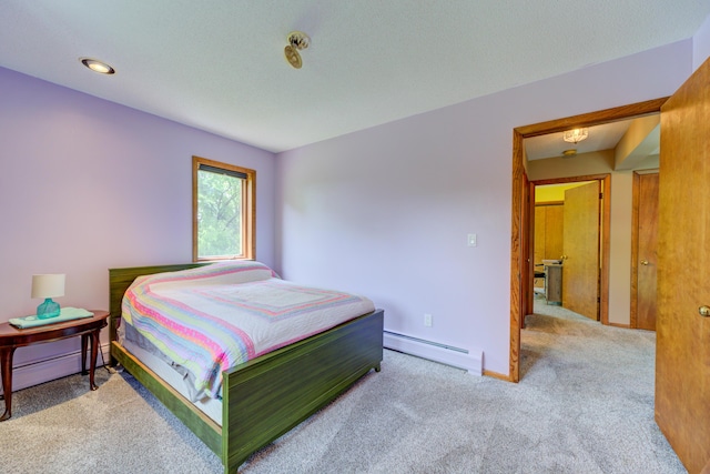 4470 Peach Ridge Ave NW, Grand Rapids, MI 49544 - bedroom featuring baseboard heating, carpet, and baseboards