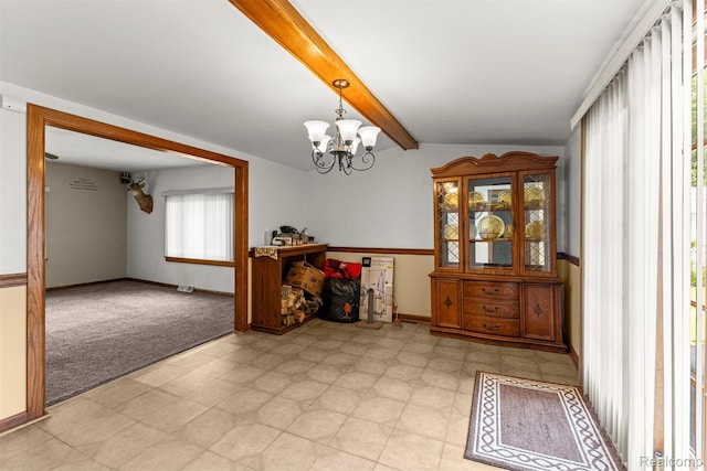 19200 Roger St, Melvindale, MI 48122 - dining area with light floors, a chandelier, baseboards, and light colored carpet