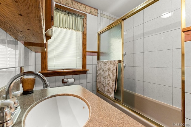 19200 Roger St, Melvindale, MI 48122 - bathroom with vanity, tile walls, and enclosed tub / shower combo