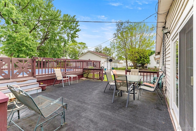 19200 Roger St, Melvindale, MI 48122 - view of patio / terrace featuring a deck and outdoor dining area