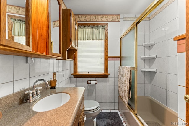 19200 Roger St, Melvindale, MI 48122 - bathroom featuring toilet, tile walls, vanity, enclosed tub / shower combo, and tile patterned floors