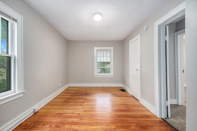 415 Cutler St SW, Grand Rapids, MI 49507 - empty room with light wood-style flooring and baseboards