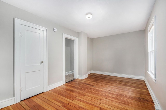 415 Cutler St SW, Grand Rapids, MI 49507 - unfurnished bedroom featuring light wood-type flooring and baseboards