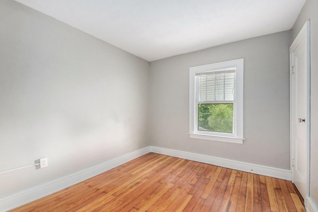415 Cutler St SW, Grand Rapids, MI 49507 - empty room with baseboards and light wood-style flooring