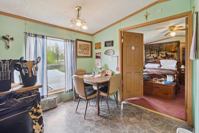 15250 142nd Ave, Big Rapids, MI 49307 - dining area featuring vaulted ceiling, crown molding, a textured ceiling, stone flooring, and a chandelier