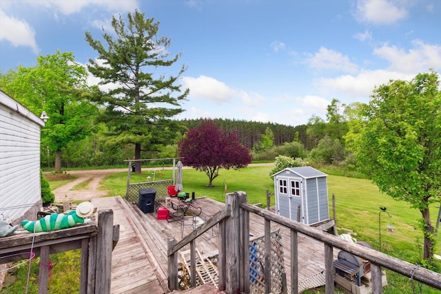 15250 142nd Ave, Big Rapids, MI 49307 - wooden deck featuring a yard and a view of trees