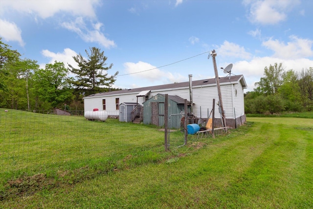 15250 142nd Ave, Big Rapids, MI 49307 - rear view of house with a lawn
