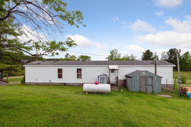 15250 142nd Ave, Big Rapids, MI 49307 - rear view of house featuring a lawn and entry steps