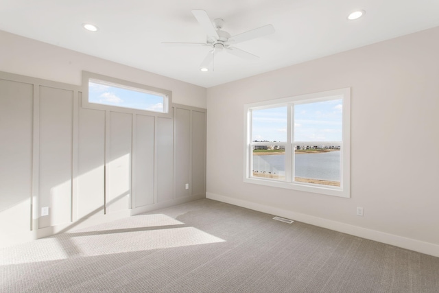 14984 Fillmore St, West Olive, MI 49460 - empty room featuring light colored carpet, plenty of natural light, recessed lighting, and baseboards