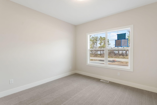 14984 Fillmore St, West Olive, MI 49460 - unfurnished room featuring carpet floors and baseboards