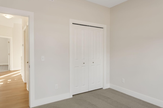14984 Fillmore St, West Olive, MI 49460 - unfurnished bedroom with baseboards and a closet