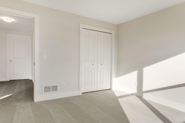 14984 Fillmore St, West Olive, MI 49460 - unfurnished bedroom with carpet, a closet, and baseboards