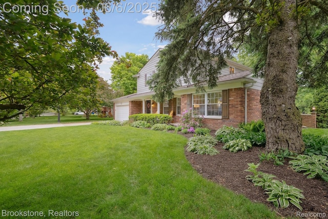 2831 Aurora Dr, Lake Orion, MI 48360 - view of front of house featuring a garage, brick siding, a front lawn, and driveway