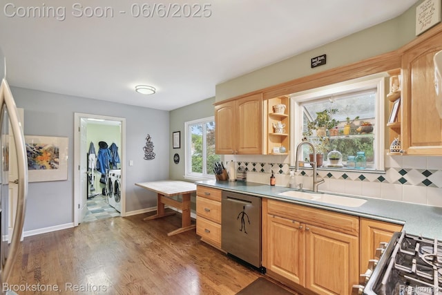 2831 Aurora Dr, Lake Orion, MI 48360 - kitchen featuring stainless steel dishwasher, independent washer and dryer, a sink, gas stove, and open shelves