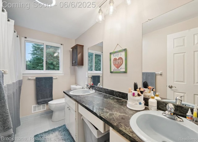 2831 Aurora Dr, Lake Orion, MI 48360 - full bathroom featuring toilet, double vanity, and tile patterned floors