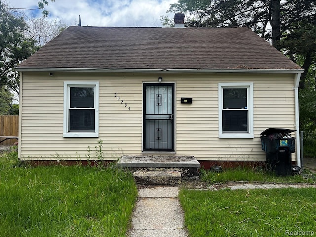 20294 Moenart St, Detroit, MI 48234 - view of front of home featuring a shingled roof and a chimney