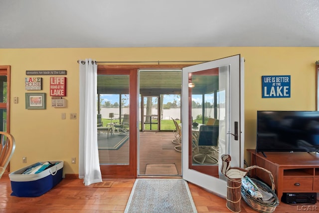 227 Lake View Dr, Hudson, MI 49247 - doorway to outside featuring wood-type flooring, baseboards, and french doors
