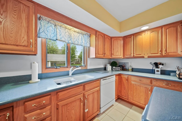 227 Lake View Dr, Hudson, MI 49247 - kitchen with white dishwasher, a sink, light tile patterned flooring, and brown cabinetry