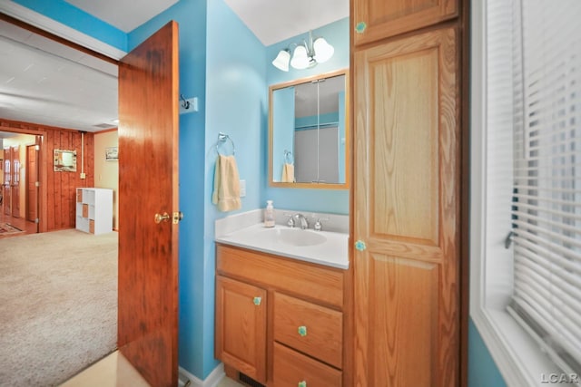 227 Lake View Dr, Hudson, MI 49247 - bathroom featuring vanity, wooden walls, and a chandelier