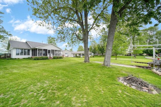 227 Lake View Dr, Hudson, MI 49247 - view of green lawn with a sunroom