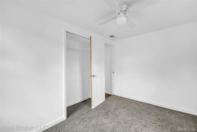 2089 Kenneth St, Burton, MI 48529 - unfurnished bedroom featuring carpet, a closet, baseboards, and ceiling fan