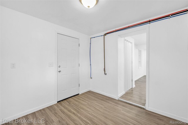 2089 Kenneth St, Burton, MI 48529 - spare room with light wood-type flooring and baseboards