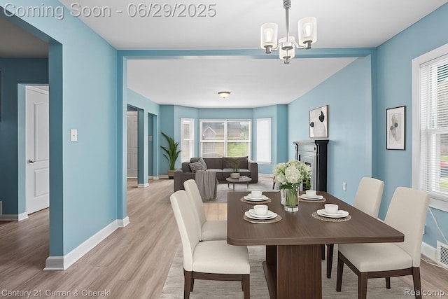 4220 Webb St, Detroit, MI 48204 - dining area featuring light wood finished floors and a chandelier