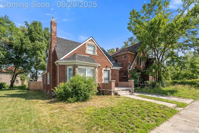 4220 Webb St, Detroit, MI 48204 - view of front of property featuring brick siding, a chimney, and roof with shingles