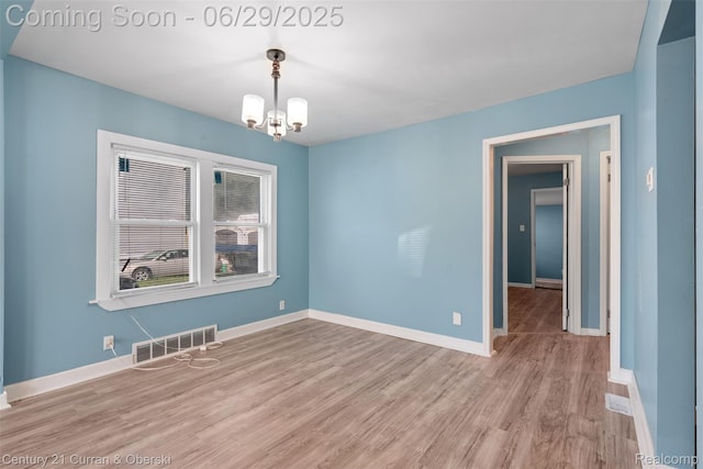 4220 Webb St, Detroit, MI 48204 - spare room with a chandelier and wood finished floors