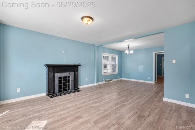 4220 Webb St, Detroit, MI 48204 - unfurnished living room featuring a chandelier, wood finished floors, and a tile fireplace