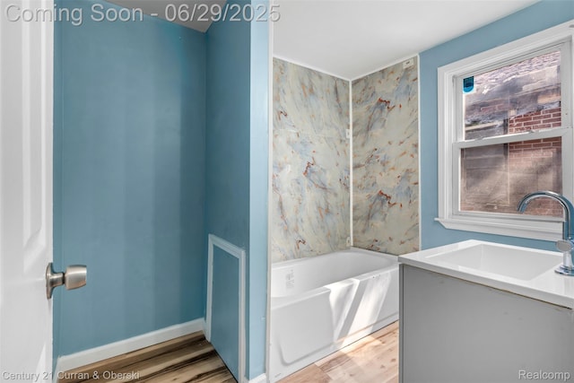 4220 Webb St, Detroit, MI 48204 - full bathroom with wood finished floors, a garden tub, and vanity
