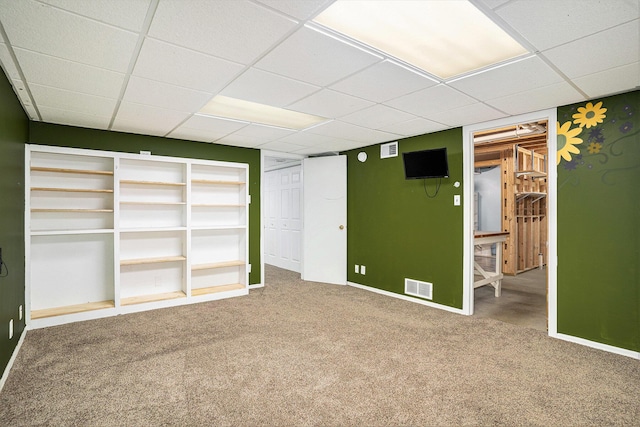 298 Chasseral Ct NW, Comstock Park, MI 49321 - unfurnished bedroom with a drop ceiling, carpet floors, and baseboards