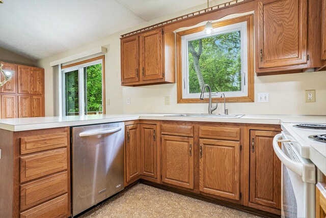 298 Chasseral Ct NW, Comstock Park, MI 49321 - kitchen with dishwasher, a sink, a peninsula, brown cabinetry, and light countertops