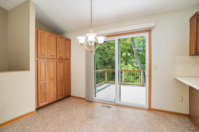 298 Chasseral Ct NW, Comstock Park, MI 49321 - unfurnished dining area with a chandelier and baseboards