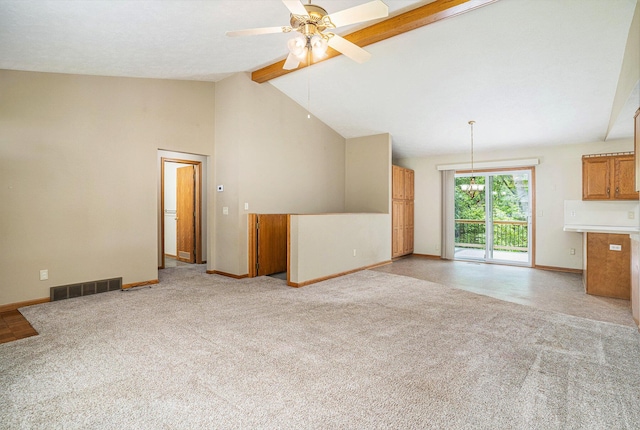 298 Chasseral Ct NW, Comstock Park, MI 49321 - unfurnished living room featuring beamed ceiling, baseboards, a ceiling fan, light colored carpet, and high vaulted ceiling