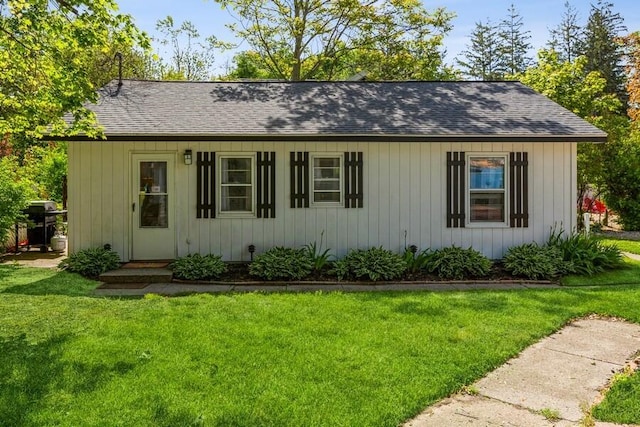 15826 Lakeshore Rd Unit 1, Union Pier, MI 49129 - view of front of property featuring a front lawn and roof with shingles