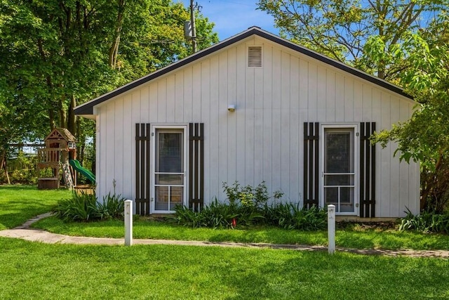 15826 Lakeshore Rd Unit 1, Union Pier, MI 49129 - view of side of home featuring a lawn and a playground