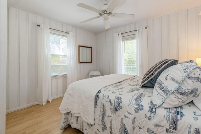 15826 Lakeshore Rd Unit 1, Union Pier, MI 49129 - bedroom with light wood finished floors, ceiling fan, and baseboards