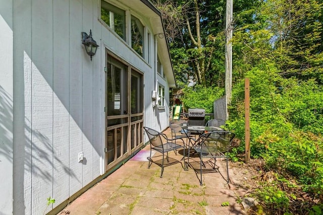 15826 Lakeshore Rd Unit 1, Union Pier, MI 49129 - view of patio / terrace with a grill and outdoor dining space