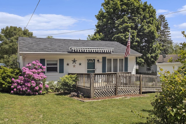 68149 Lawndale St, Edwardsburg, MI 49112 - bungalow-style house with a front yard, covered porch, and a shingled roof