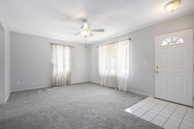 68149 Lawndale St, Edwardsburg, MI 49112 - foyer entrance with ceiling fan, light carpet, and baseboards