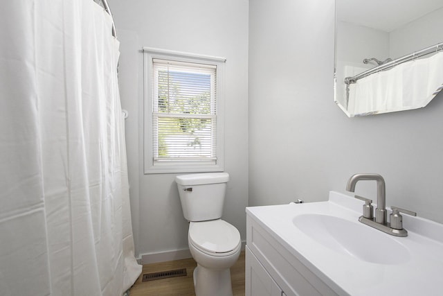 68149 Lawndale St, Edwardsburg, MI 49112 - bathroom featuring toilet, vanity, wood finished floors, and curtained shower