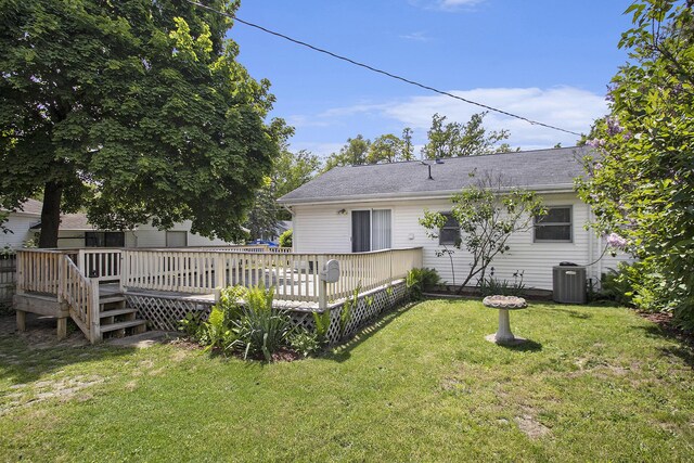 68149 Lawndale St, Edwardsburg, MI 49112 - back of house featuring a deck, a lawn, and central AC