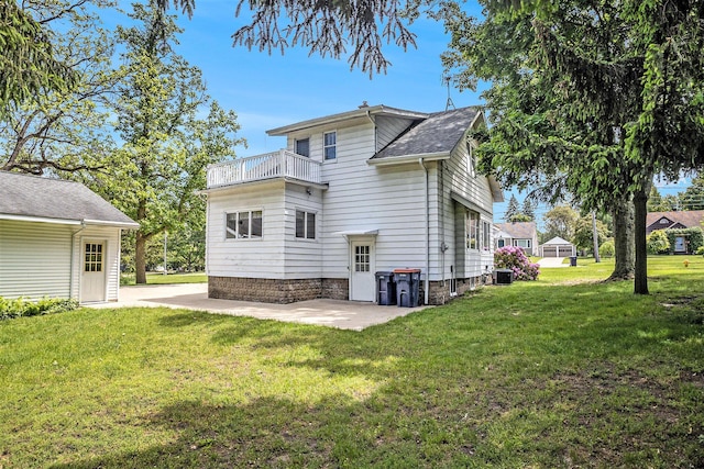269 E 24th St, Holland, MI 49423 - rear view of property featuring a balcony, a patio area, a lawn, and central AC unit