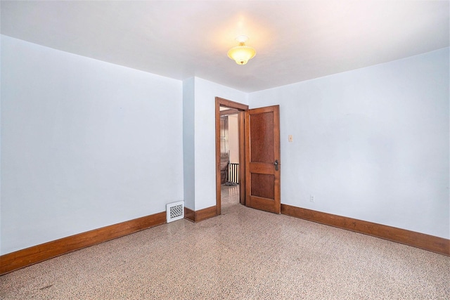 269 E 24th St, Holland, MI 49423 - spare room with baseboards and speckled floor