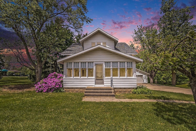 269 E 24th St, Holland, MI 49423 - view of front of house with a front yard, a shingled roof, and entry steps