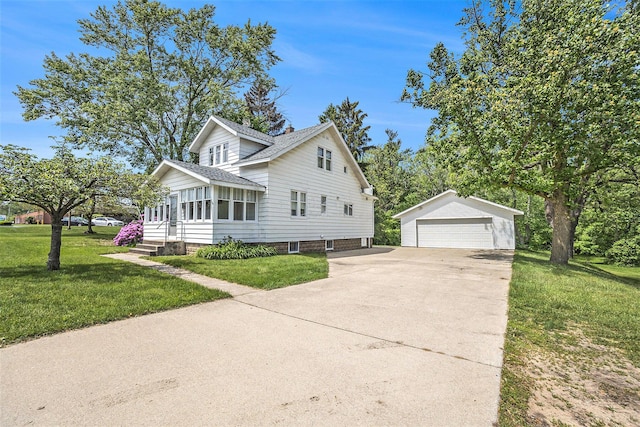 269 E 24th St, Holland, MI 49423 - view of front of home with an outbuilding, a garage, a front lawn, and a shingled roof
